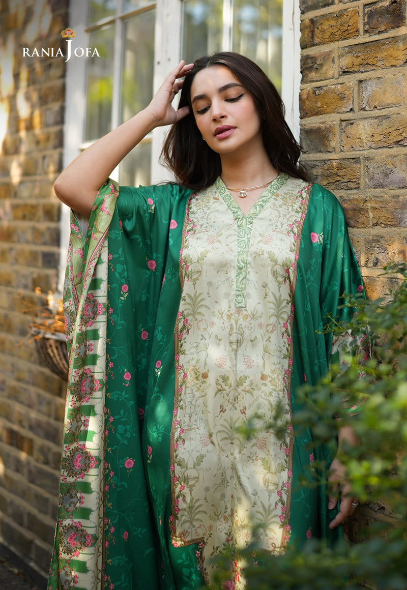 Rania Jofa Emerald RJPS-06 cream charmeuse silk floral printed shirt with emerald dupatta – upper body relaxed pose leaning against London brick wall